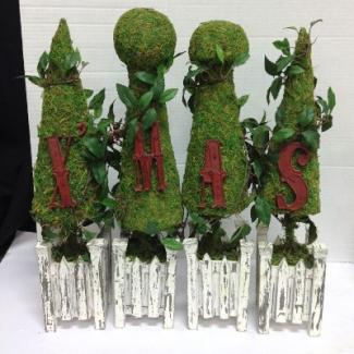 How do you clean artificial topiary trees?
